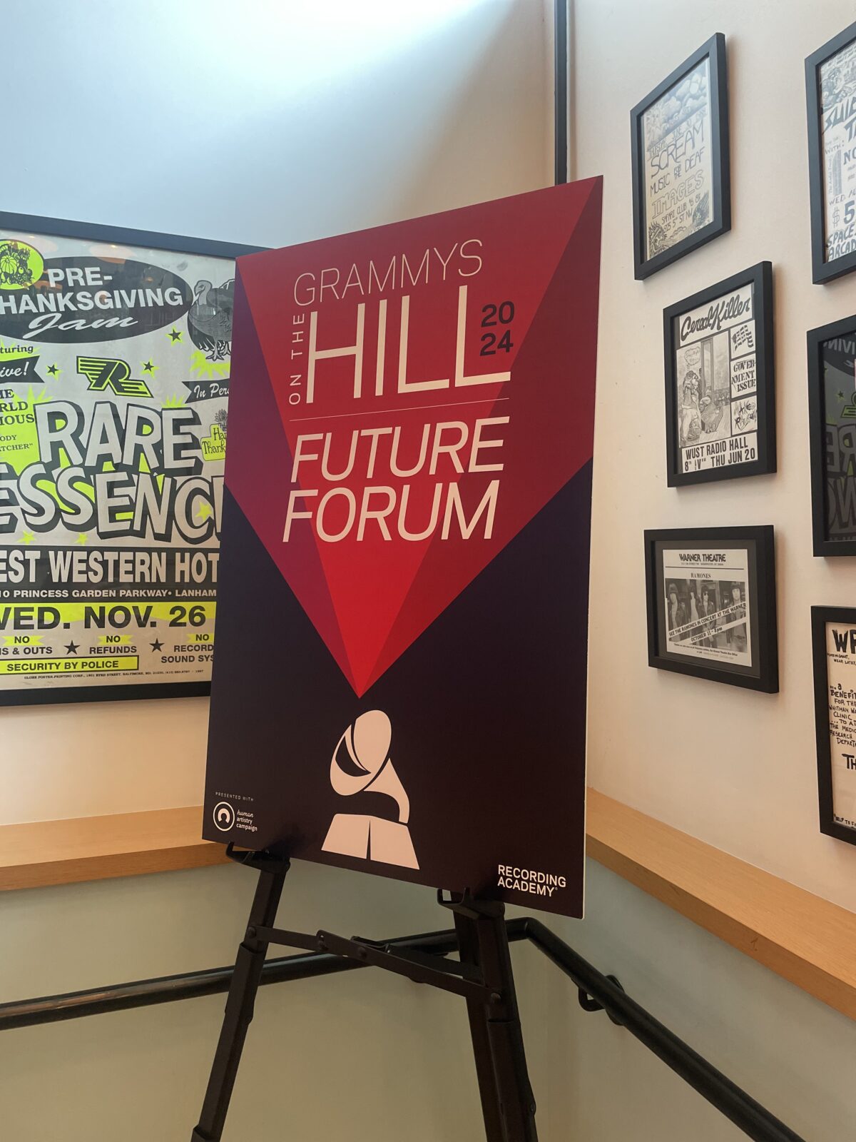 A sign that reads: "Grammys on the Hill 2024 Future Forum," with a picture of a Grammy award at the bottom of the sign