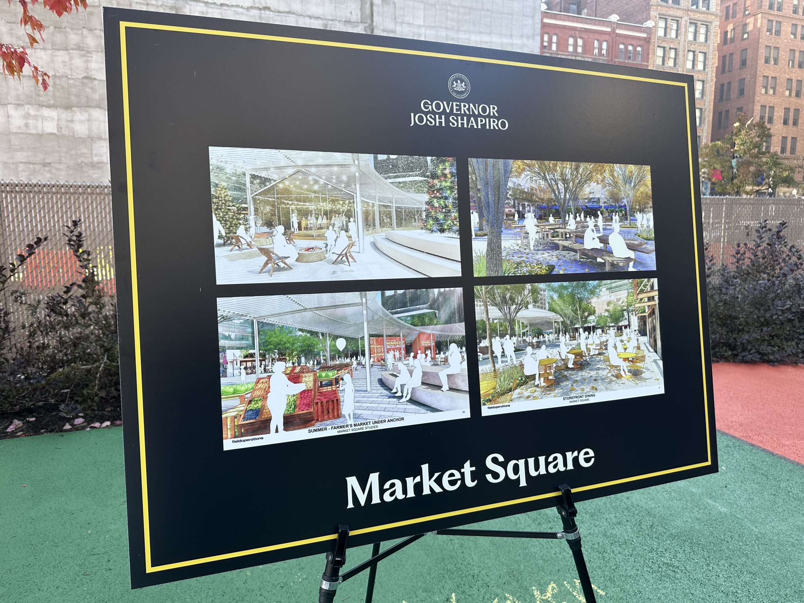 A sign displays four architectural renderings of Market Square, Governor Josh Shapiro at the top.